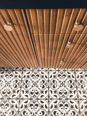 a room with a wooden ceiling and a bed at Supreme Apartment in the City Center in Kraków