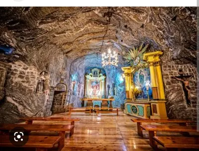 a church with wooden benches in a cave at Apartament Blondynka Miasto Soli Bochnia in Bochnia