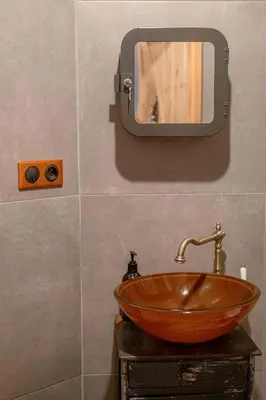 a bathroom sink with a mirror on the wall at Orzeszkowej PREMIUM Apartament in Kraków
