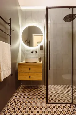 a bathroom with a sink and a mirror at Apartament na Krakowskim Kazimierzu in Kraków