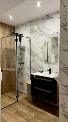 a bathroom with a shower and a sink at Apartament 36 Zator by Housine in Zator