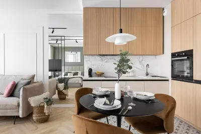 a kitchen and living room with a table and chairs at #2 OLIVE Apartment City Center FREE GARAGE in Kraków