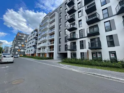 an empty street in front of a large apartment building at #2 OLIVE Apartment City Center FREE GARAGE in Kraków