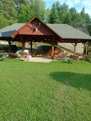 a pavilion in a park with a grass field at Agroturystyka Leśna Ostoja Borek in Golczowice