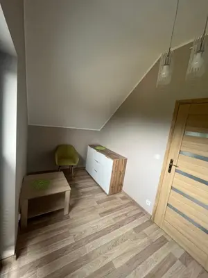 a room with a desk and a chair and a cabinet at Nova 26 in Klucze