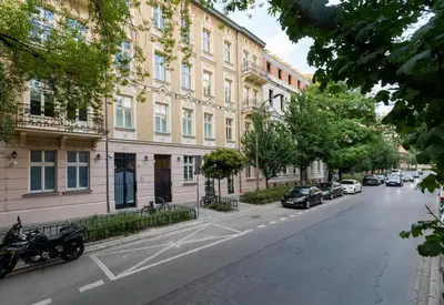 a street with cars parked on the side of a building at Apartament w centrum Krakowa 109 in Kraków