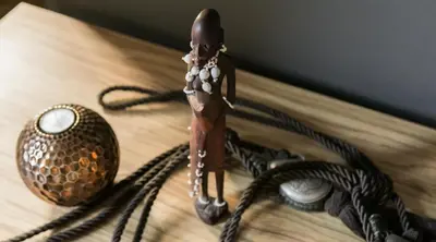 a toy figurine on a table next to a vase at Cracowdays in Kraków