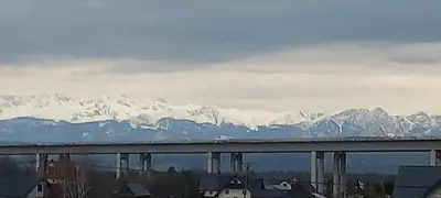 a view of snow covered mountains from a bridge at Apartament Wierchy in Klikuszowa