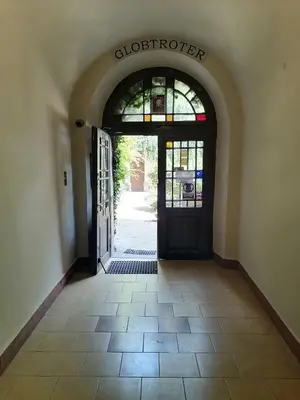an entrance to a building with an open door at Globtroter Guest House in Kraków