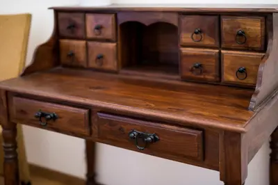 a wooden cabinet with drawers on top of a table at Apartamenty Gołębia 3 in Kraków