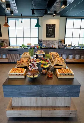 a table with many different types of food on it at Hotel Convictus Cracovia for business & travellers in Kraków