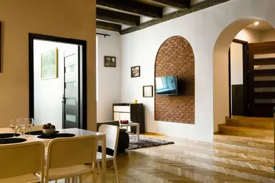 a dining room with a table and chairs at P&J Apartments Floriańska in Kraków