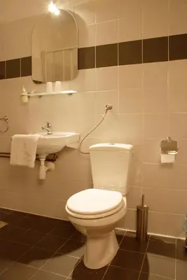 a bathroom with a toilet and a sink at Dom Casimi in Kraków
