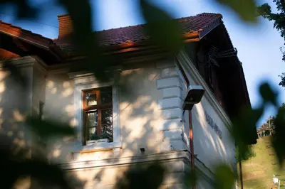 a house with a window on the side of it at Apartamenty Stacja Kasina in Kasina Wielka