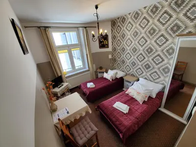 an overhead view of a living room with two beds at Pokoje Gościnne Unikat - Self check in in Kraków