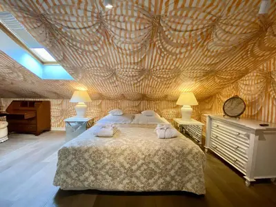a bedroom with a bed with two pillows on it at The Bonerowski Palace Boutique Hotel in Kraków