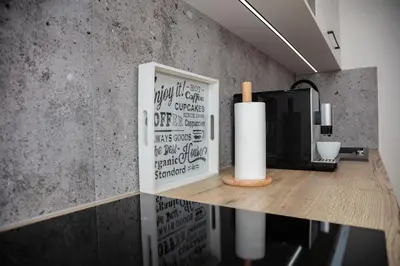 a room with a counter with a television and a paper towel holder at Apartament na Skarpie in Zator