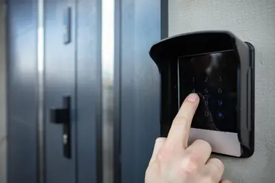 a person pressing a door button with their index finger at Apartament na Skarpie in Zator