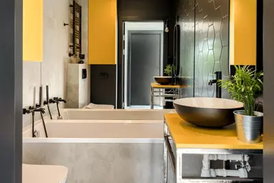 a bathroom with a large tub and a sink at STODOŁY94 in Mordarka