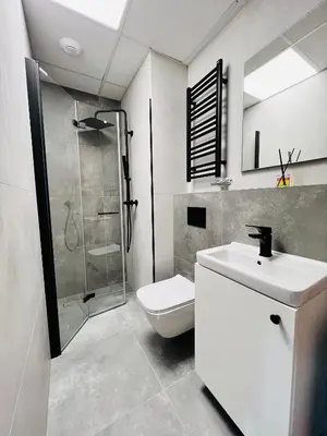 a bathroom with a toilet and a sink and a shower at CozyStudio with Sauna in Kraków