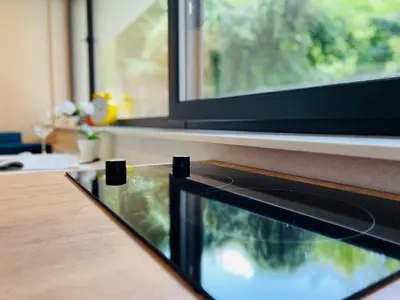 a close up of a fish tank on a table with a window at CozyStudio with Sauna in Kraków