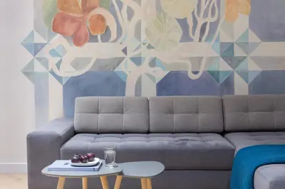 a living room with a couch and a table at Cadena Gallery Apartments Wyspiański in Kraków
