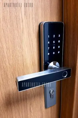 a hotel room door opener with a cell phone in it at Aparthotel ZATOR Glam 52 jacuzzi in Zator