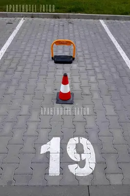 a traffic cone sitting in a parking lot at Aparthotel ZATOR Glam 52 jacuzzi in Zator