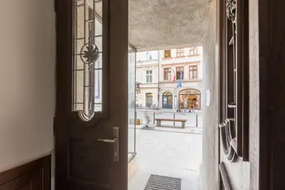 an open door with a view of a street at Cadena Gallery Apartments Mehoffer in Kraków