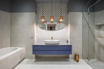 a bathroom with a sink and a tub and a mirror at Cadena Gallery Apartments Mehoffer in Kraków