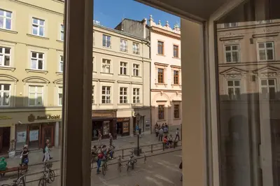 a view of a city street from a window at Cadena Gallery Apartments Mehoffer in Kraków