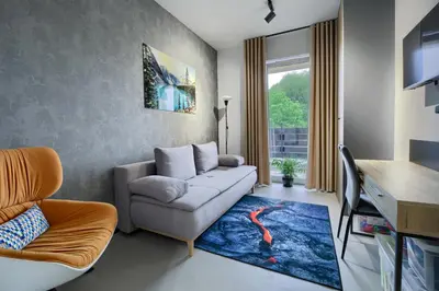 a living room with a couch and a table at Premium Apartment Eleven in Zator