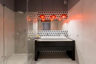 a bathroom with a sink and a shower at Cadena Gallery Apartments Witkacy in Kraków