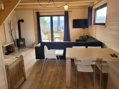 a living room with a couch and a table at Widokówka in Zawoja