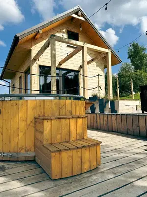 a house on a deck with a building at Duchałówka 2.0 in Koszarawa