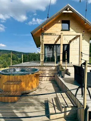 a house with a hot tub on a wooden deck at Duchałówka 2.0 in Koszarawa