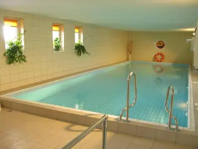 a large swimming pool in a building at Korona Żywca - MADOHORA in Ślemień