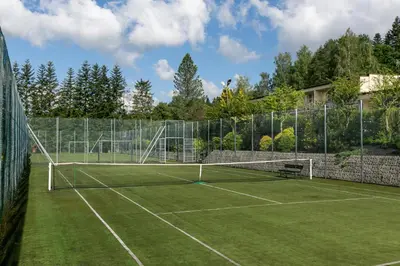 a tennis court with a net on top of it at Korona Żywca - MADOHORA in Ślemień