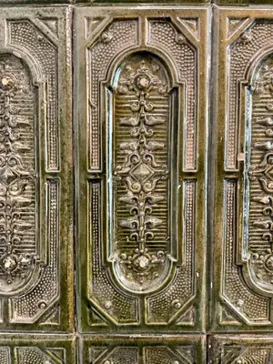 an old wooden door with a design on it at Golden Queen Apartments City Center in Kraków