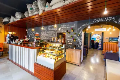 a bakery with a display case of food at Jordan Pokoje Gościnne in Kraków