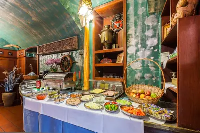 a table with a buffet of food on it at Jordan Pokoje Gościnne in Kraków