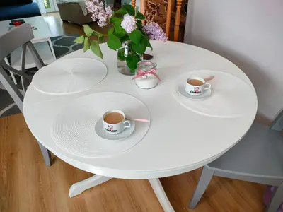 a white table with two cups of coffee on it at Domek Mordarka in Limanowa
