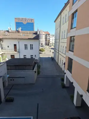 a view of an alley between two buildings at Doris Day Apartment in Kraków