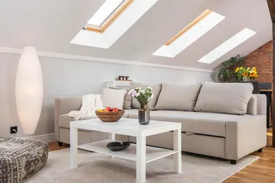 a living room with a couch and a table at Riverside Premium Class Apartment - by Upstairs in Kraków