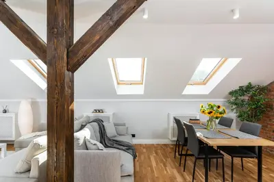 a living room with a table and a couch at Riverside Premium Class Apartment - by Upstairs in Kraków