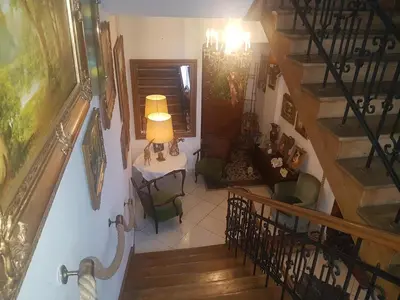 an overhead view of a staircase with a table and chairs at Willa Marysin in Maków Podhalański