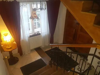 an overhead view of a staircase with a light and a window at Willa Marysin in Maków Podhalański