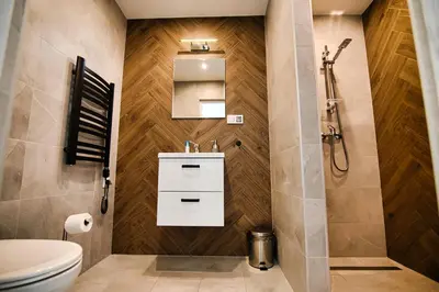 a bathroom with a toilet and a sink and a shower at HOUSE OF ENERGY - Zator Przeciszów in Przeciszów