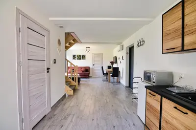 a kitchen with a hallway leading to a living room at HOUSE OF ENERGY - Zator Przeciszów in Przeciszów