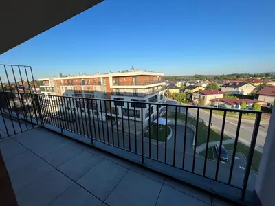 a balcony with a view of a city at Apartament 4 piętro in Zator